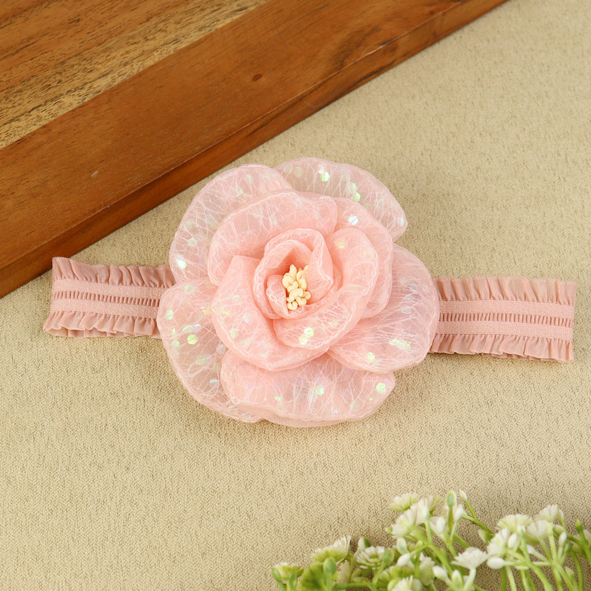 soft, stretchable elastic headband featuring pastel flowers.