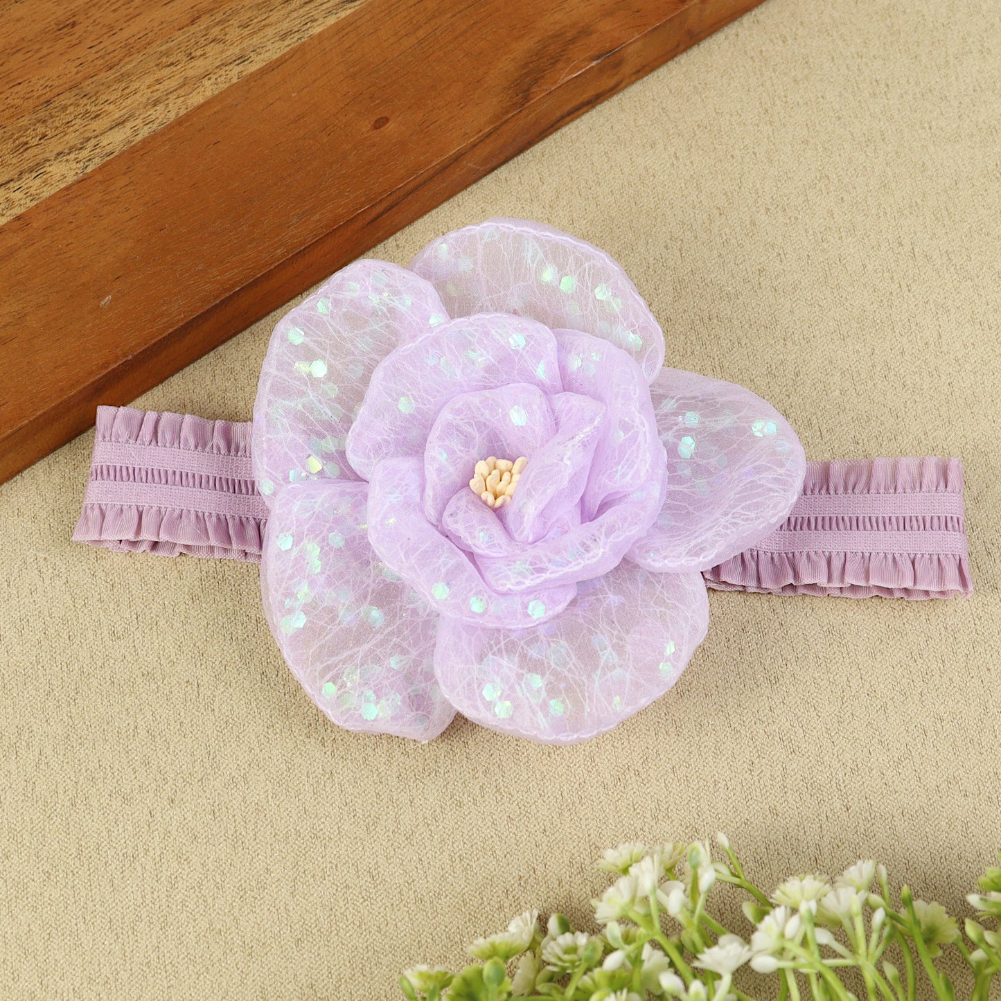 soft, stretchable elastic headband featuring pastel flowers.