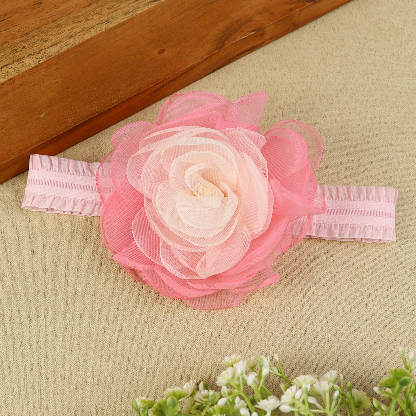 soft, stretchable elastic headband featuring pastel flowers.