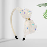 Soft, stretchable, and comfortable free-size hair band designed for young girls.