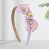 Soft, stretchable, and comfortable free-size hair band designed for young girls.