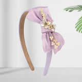 Soft, stretchable, and comfortable free-size hair band designed for young girls.