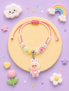 Doll charm bracelet Rakhi on a drawstring band, 