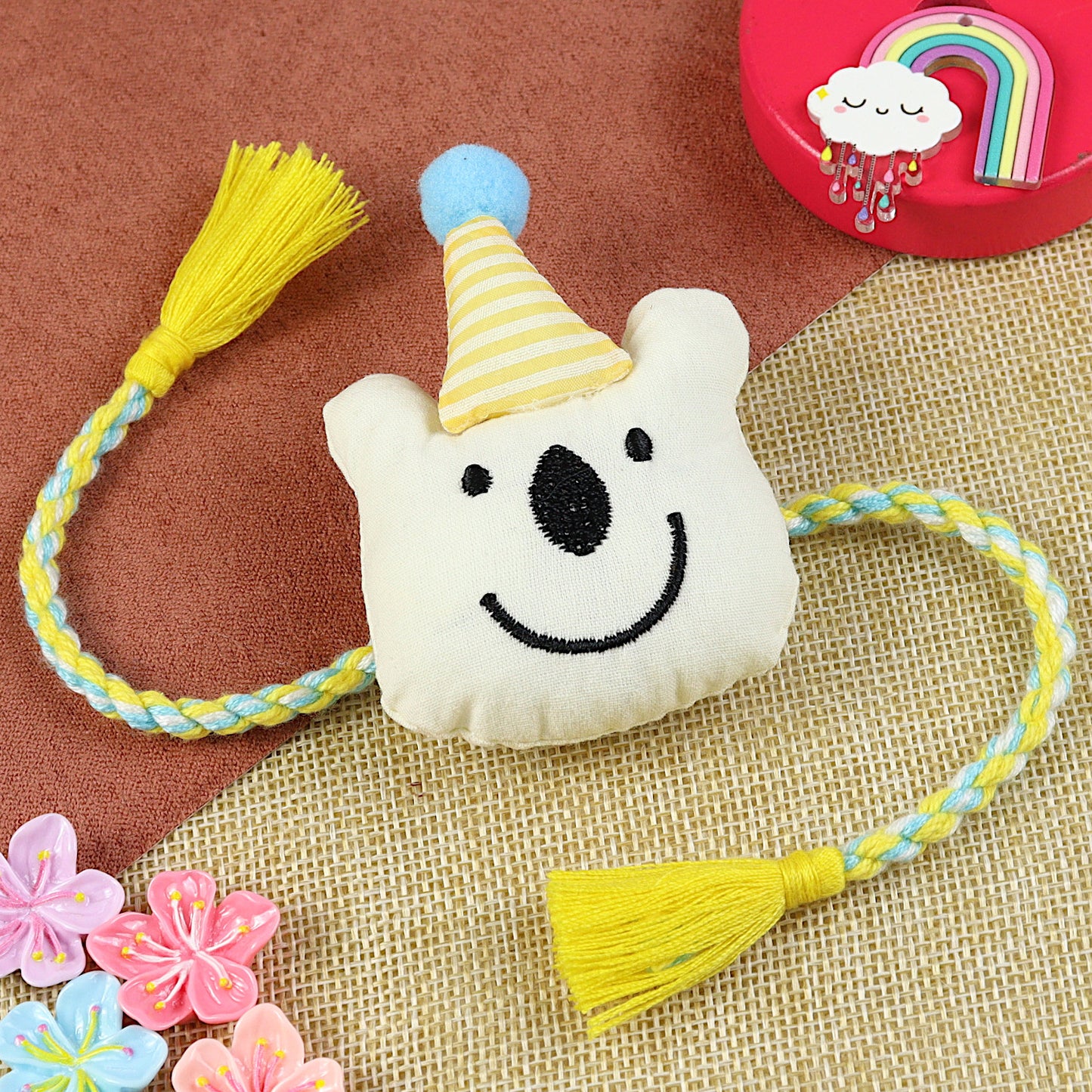 Bear Cap kids Rakhi, laid flat