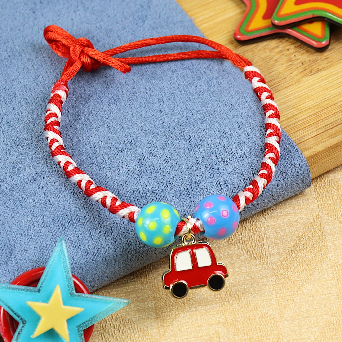 Red Car kids Rakhi, laid flat