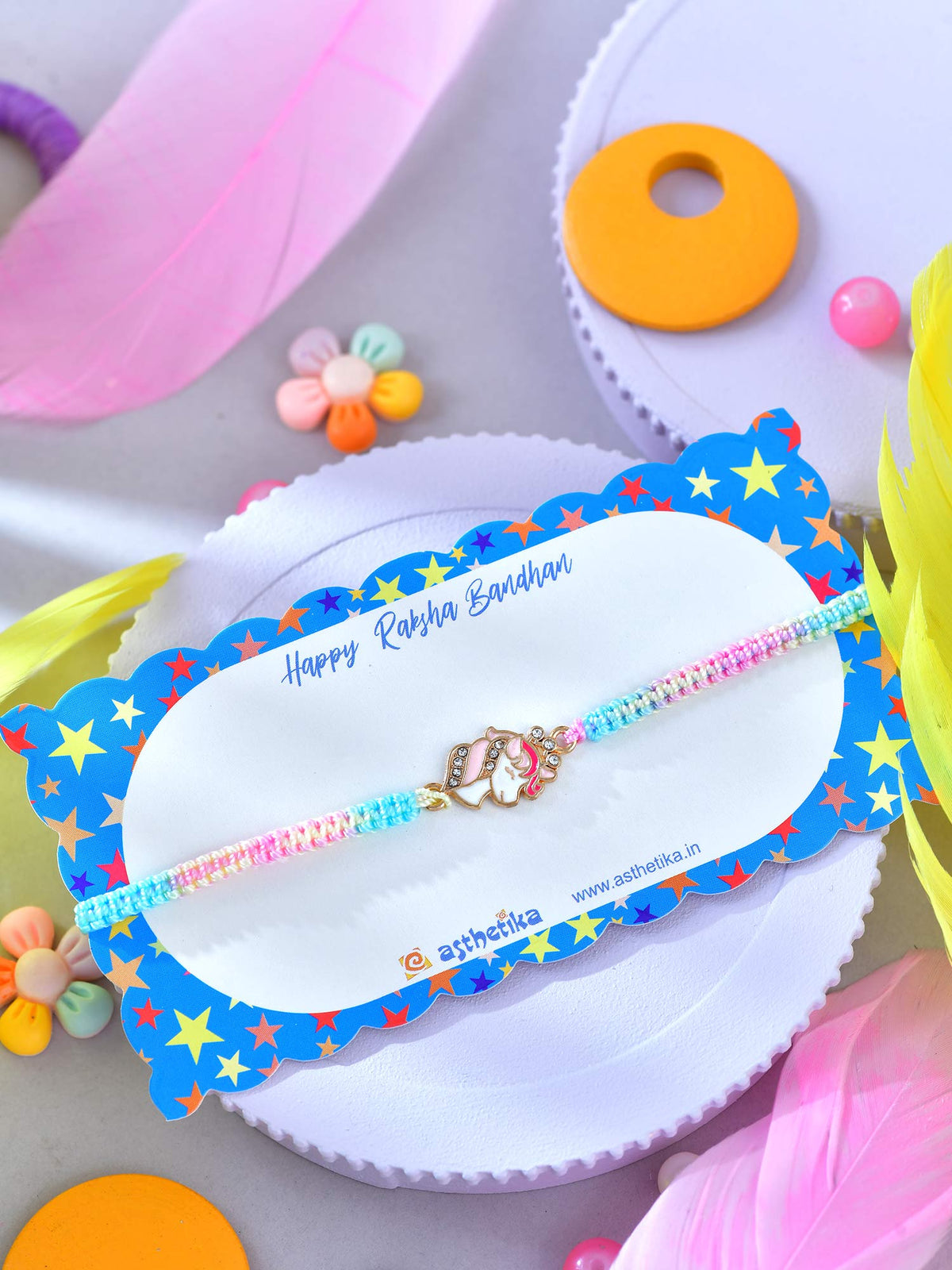 Asthetika unicorn drawstring bracelet Rakhi in packaging