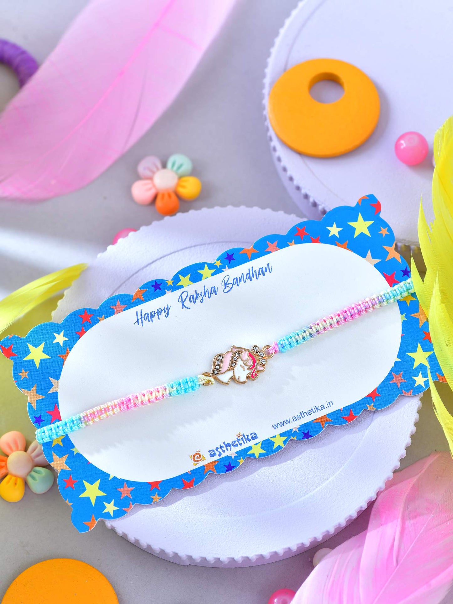 Asthetika unicorn drawstring bracelet Rakhi in packaging