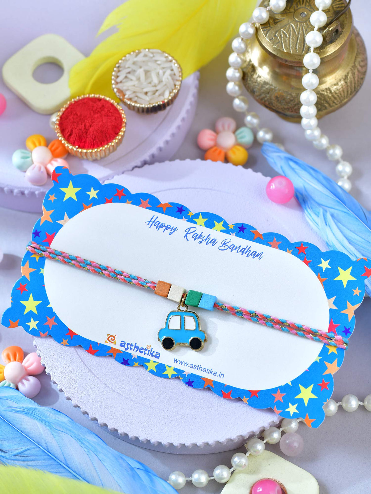 Asthetika car charm bracelet Rakhi in packaging