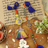 Om Tassel Bhai Bhabhi Rakhi pair — Rakhi and Lumba laid flat