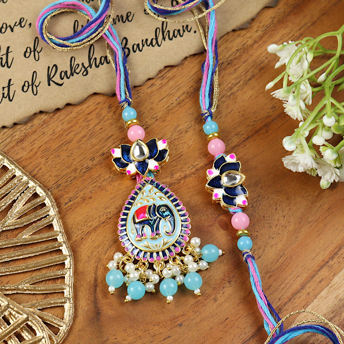 Elephant Kundan Lotus Bhai Bhabhi Rakhi pair — Rakhi and Lumba laid flat