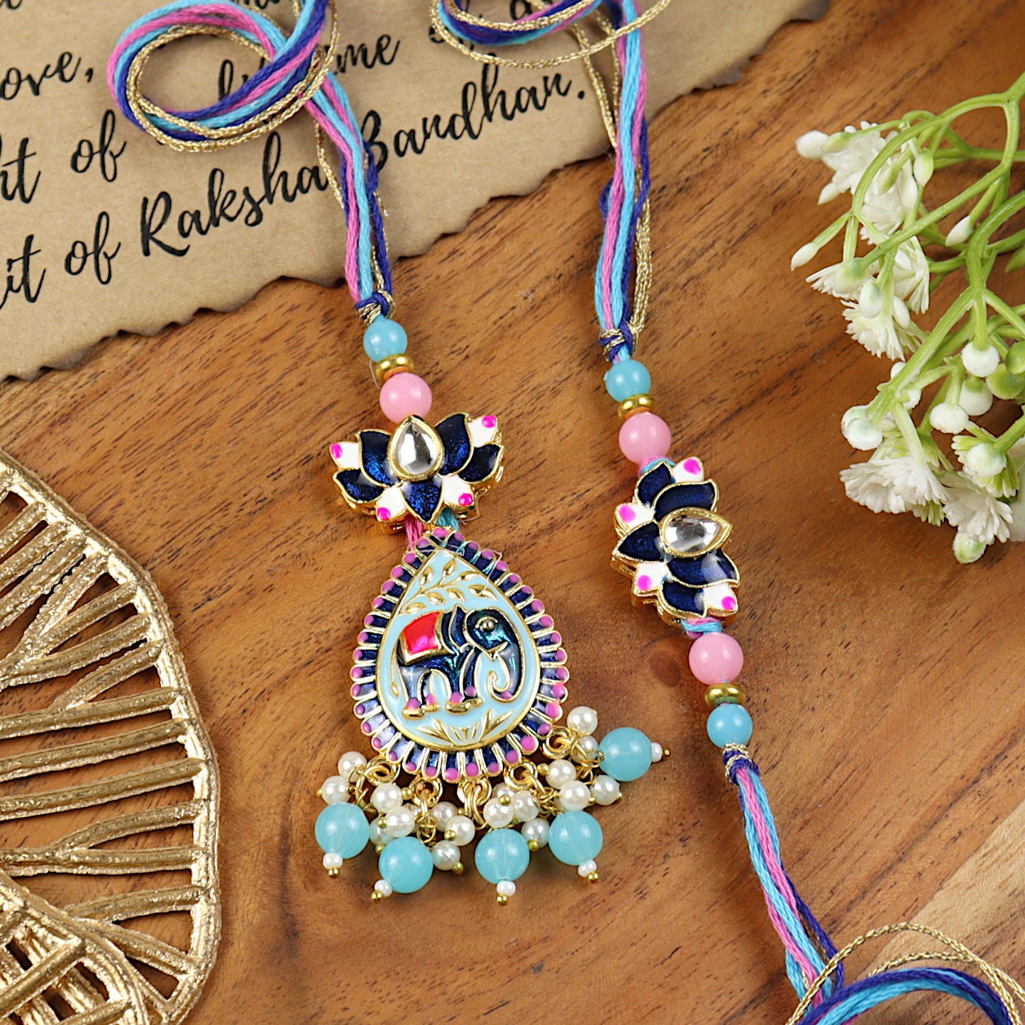 Elephant Kundan Lotus Bhai Bhabhi Rakhi pair — Rakhi and Lumba laid flat