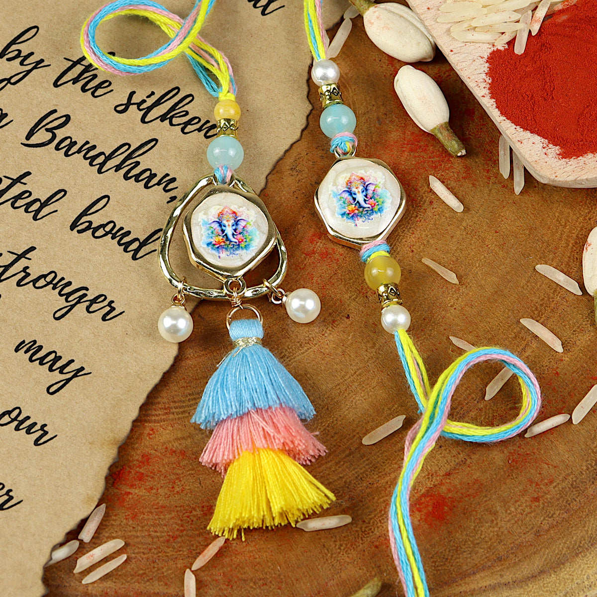 Ganpati Tassel Bhai Bhabhi Rakhi pair — Rakhi and Lumba laid flat