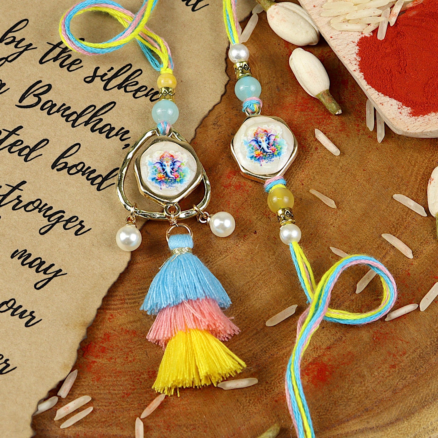 Ganpati Tassel Bhai Bhabhi Rakhi pair — Rakhi and Lumba laid flat
