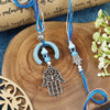 Hamsa Evil Eye Bhai Bhabhi Rakhi pair — Rakhi and Lumba laid flat