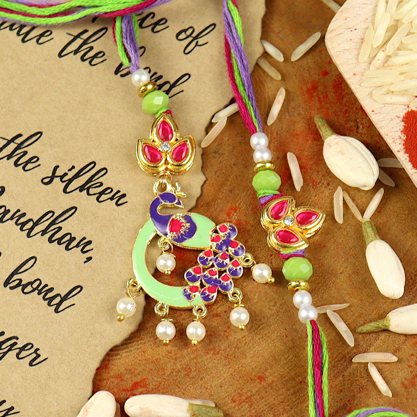 Peacock Meena Kundan Bhai Bhabhi Rakhi pair — Rakhi and Lumba laid flat