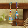 Meena Kundan Jhumki Bhai Bhabhi Rakhi pair — Rakhi and Lumba laid flat