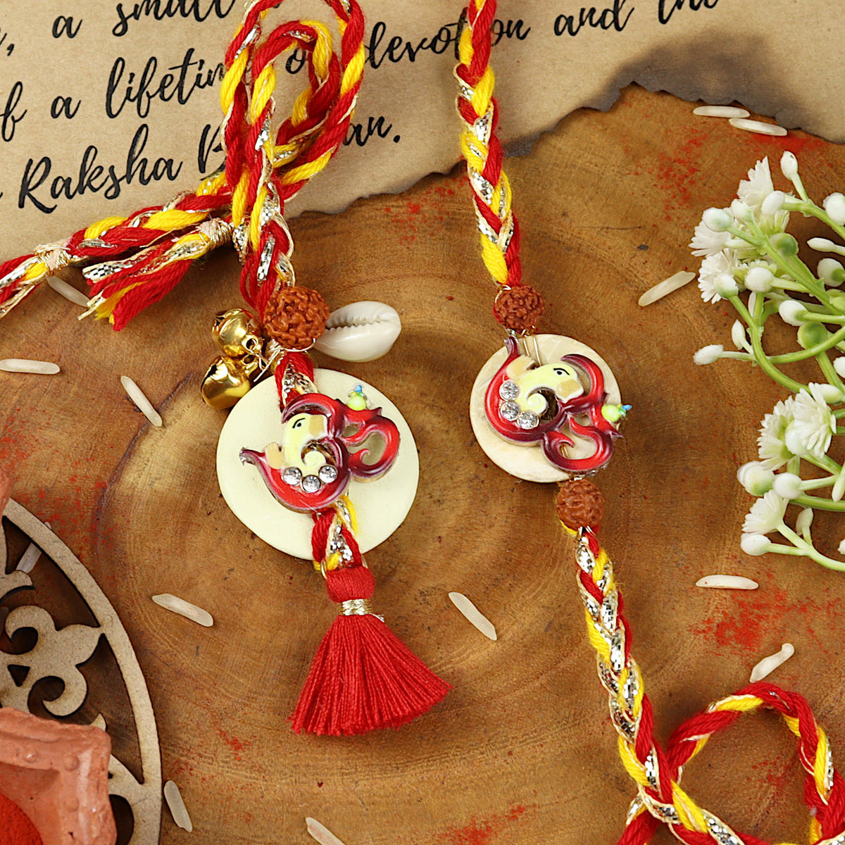 Om Ganesha Bhai Bhabhi Rakhi pair — Rakhi and Lumba laid flat