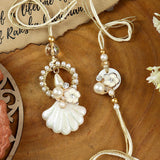 Floral Meena Bhai Bhabhi Rakhi pair — Rakhi and Lumba laid flat