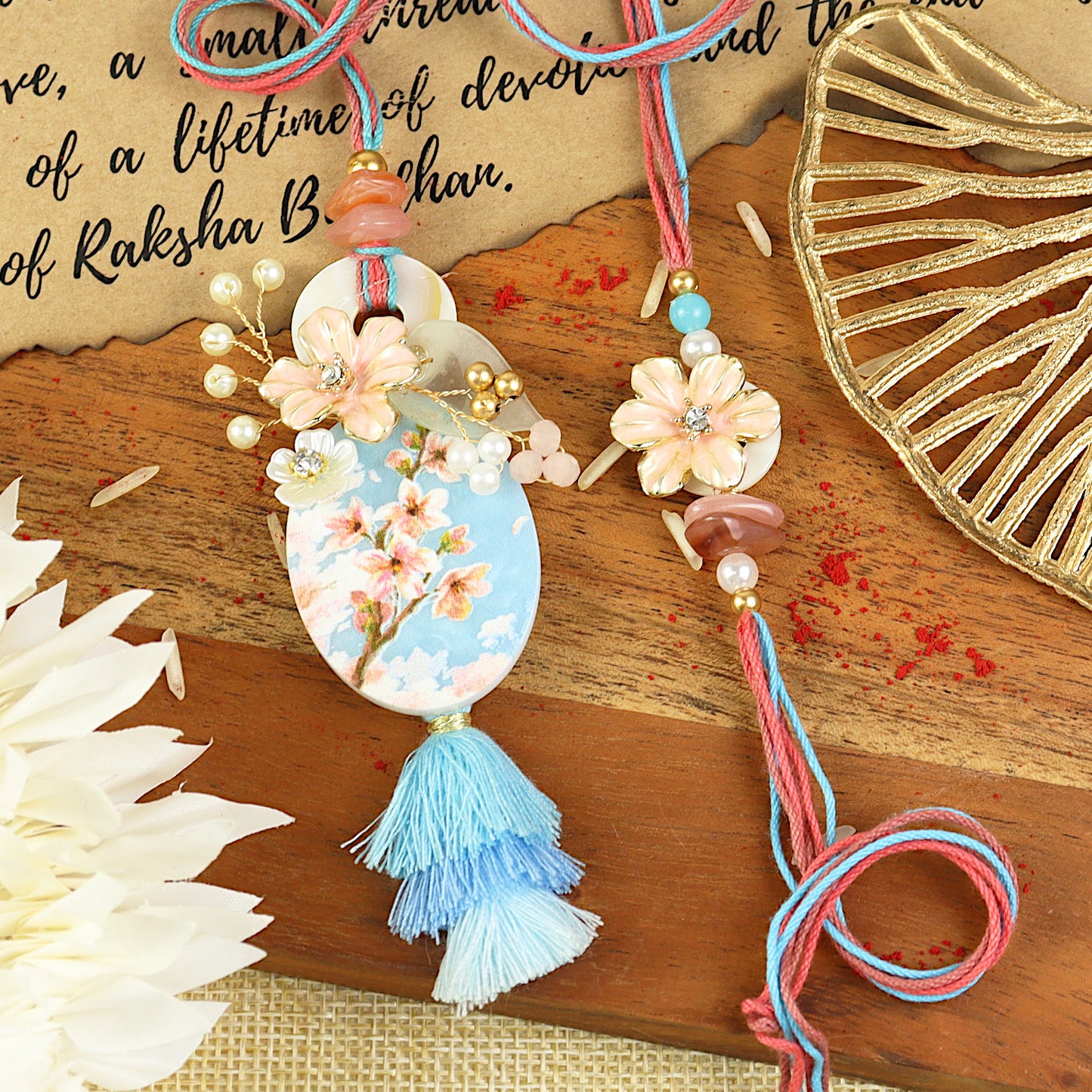 Floral Printed Motif Bhai Bhabhi Rakhi pair — Rakhi and Lumba laid flat