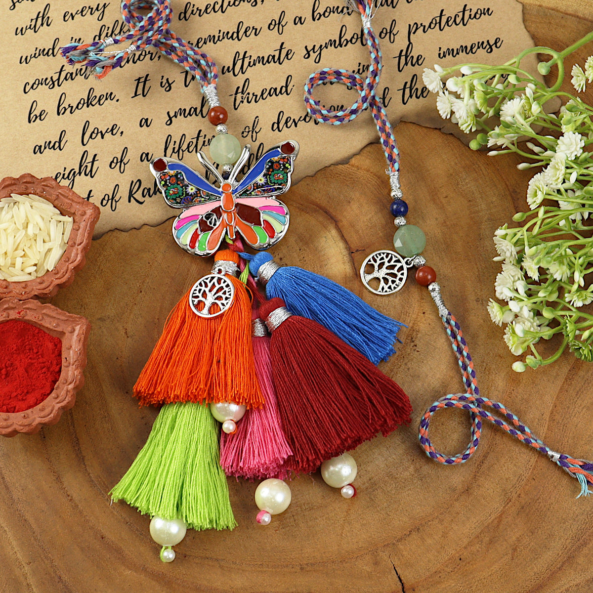 Butterfly Brooch Multi-Tassel Bhai Bhabhi Rakhi pair — Rakhi and Lumba laid flat