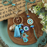 Hamsa Evil Eye Bag Charm Bhai Bhabhi Rakhi pair — Rakhi and Lumba laid flat