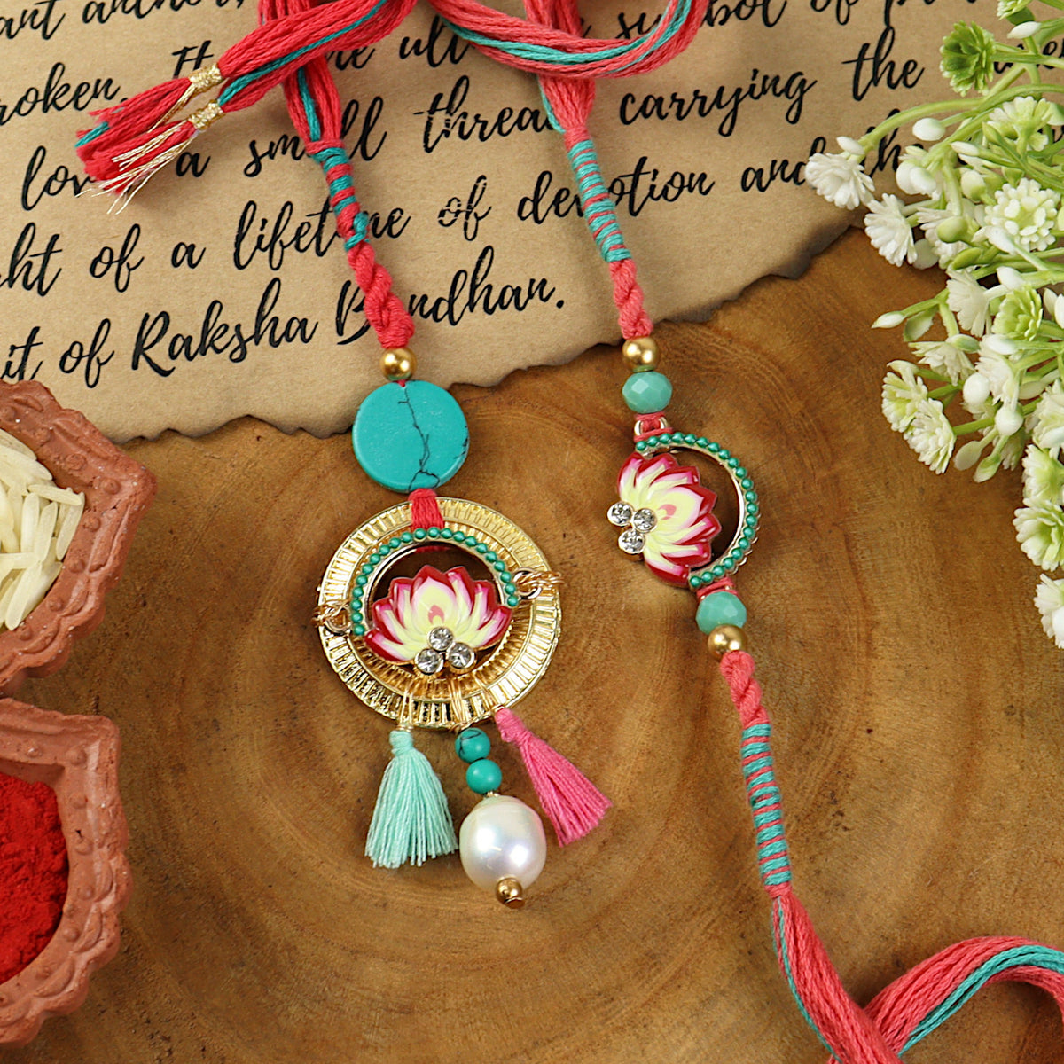 Lotus Enamel Turquoise Stone Bhai Bhabhi Rakhi pair — Rakhi and Lumba laid flat