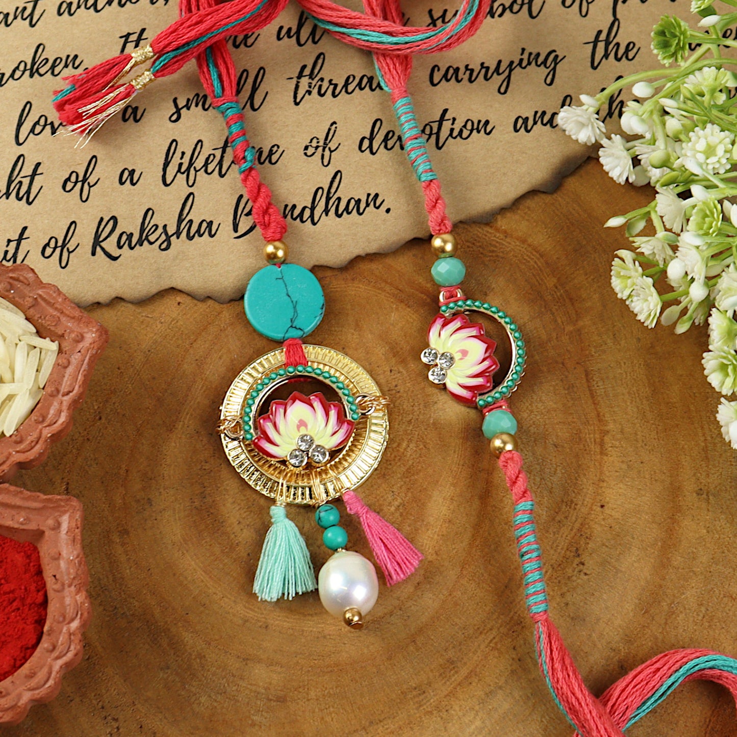 Lotus Enamel Turquoise Stone Bhai Bhabhi Rakhi pair — Rakhi and Lumba laid flat