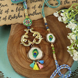 Peacock Feather Bhai Bhabhi Rakhi pair — Rakhi and Lumba laid flat