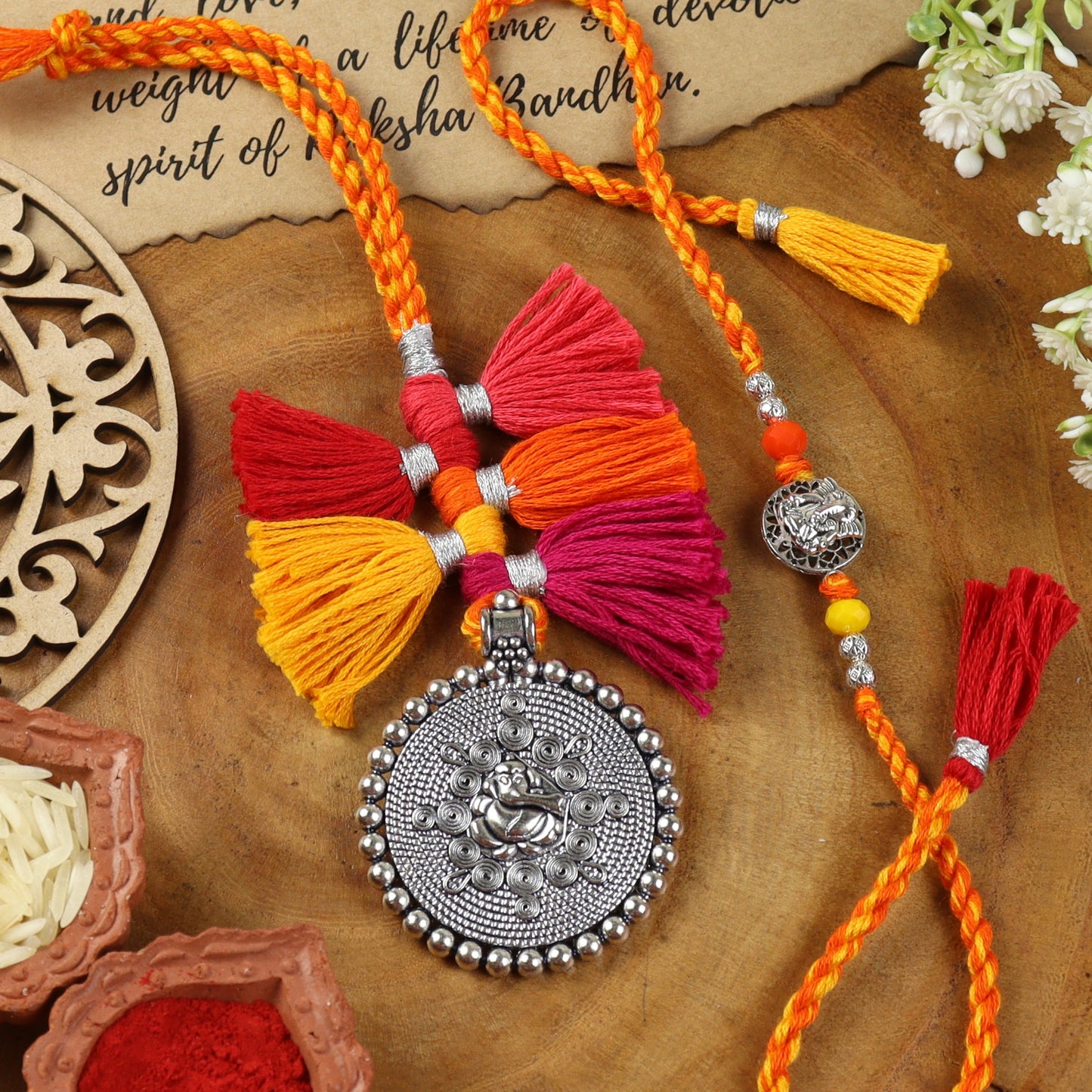 Oxidized Silver Pendant Tassel Bhai Bhabhi Rakhi pair — Rakhi and Lumba laid flat