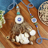 Evil Eye Jute Tassels Shell Bhai Bhabhi Rakhi pair — Rakhi and Lumba laid flat