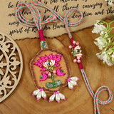 Hand Embroidered Lotus Bhai Bhabhi Rakhi pair — Rakhi and Lumba laid flat