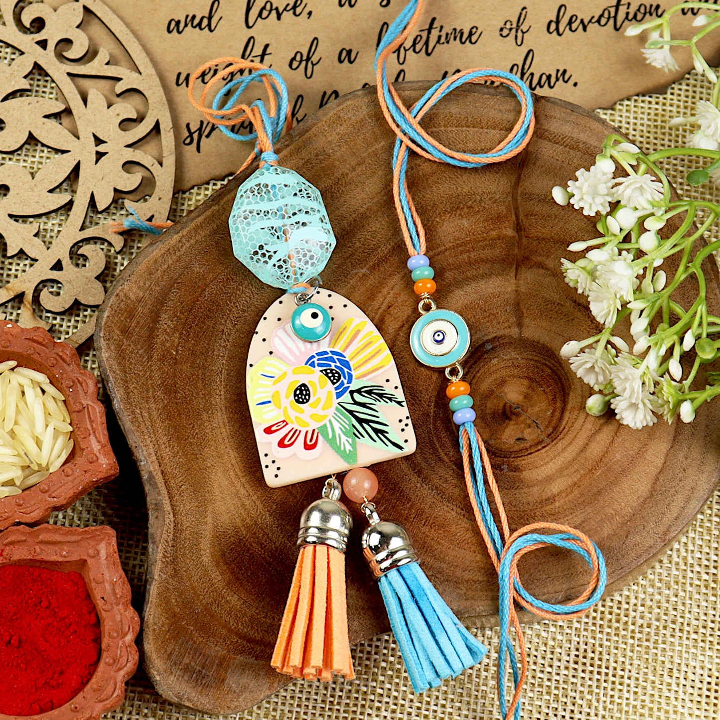 Boho Floral & Evil Eye Bhai Bhabhi Rakhi pair — Rakhi and Lumba laid flat