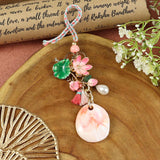 Meena Lotus Bag Charm Lumba, laid flat
