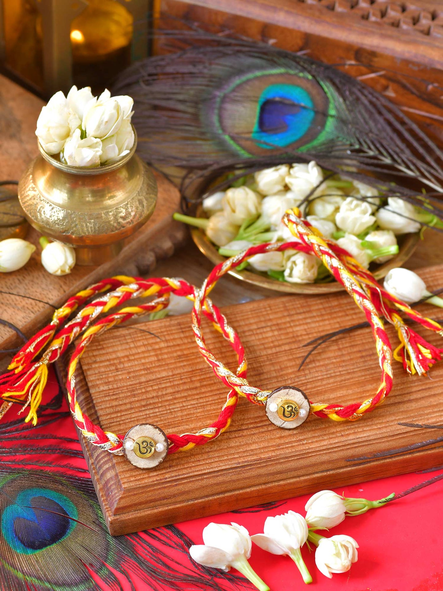 Om Charm Rakhis set of 2 with Om charms on thread cords
