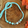 Turquoise Stone Healing Rakhi Packed in a Features Card