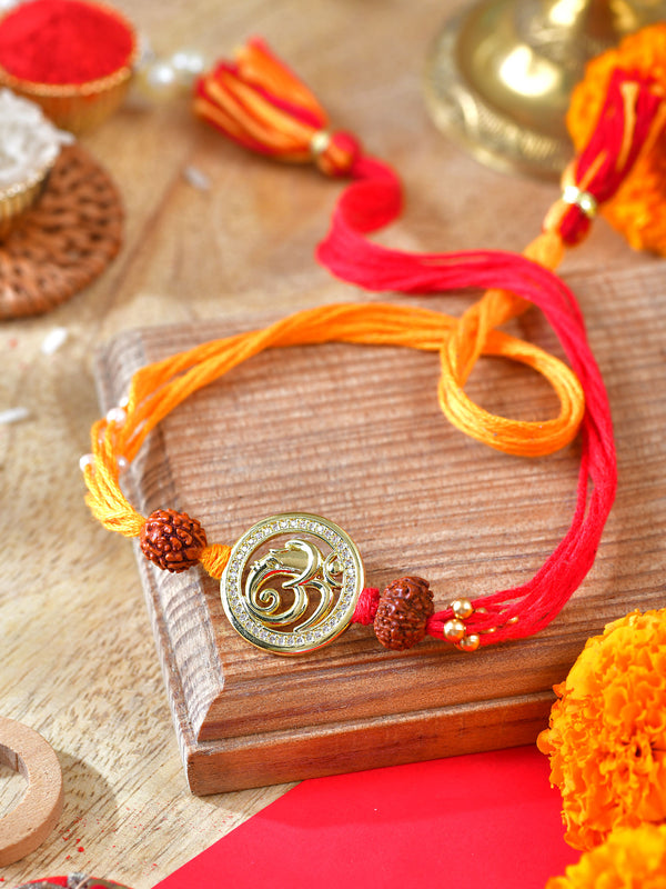 Om Ganesha Zircon Rakhi with zircon-set detailing on a thread cord