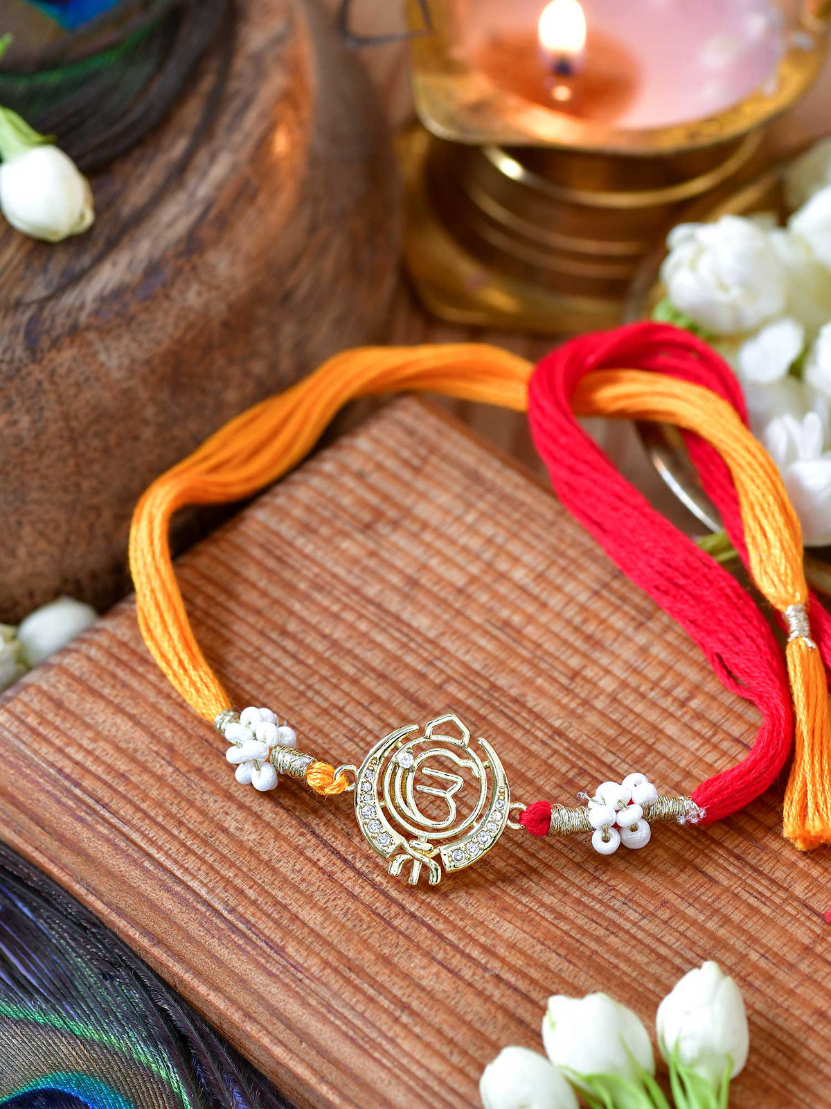 Ek Omkar Zircon Rakhi with zircon-set Ek Omkar motif on a thread cord