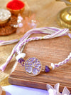 Tree of Life Amethyst Rakhi with amethyst-set Tree of Life motif on a cord