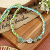 Green Aventurine Tree of Life Rakhi in green aventurine, laid flat