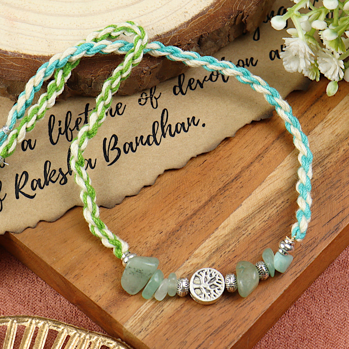 Green Aventurine Tree of Life Rakhi in green aventurine, laid flat