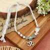 Moonstone Om Rakhi in moonstone, laid flat