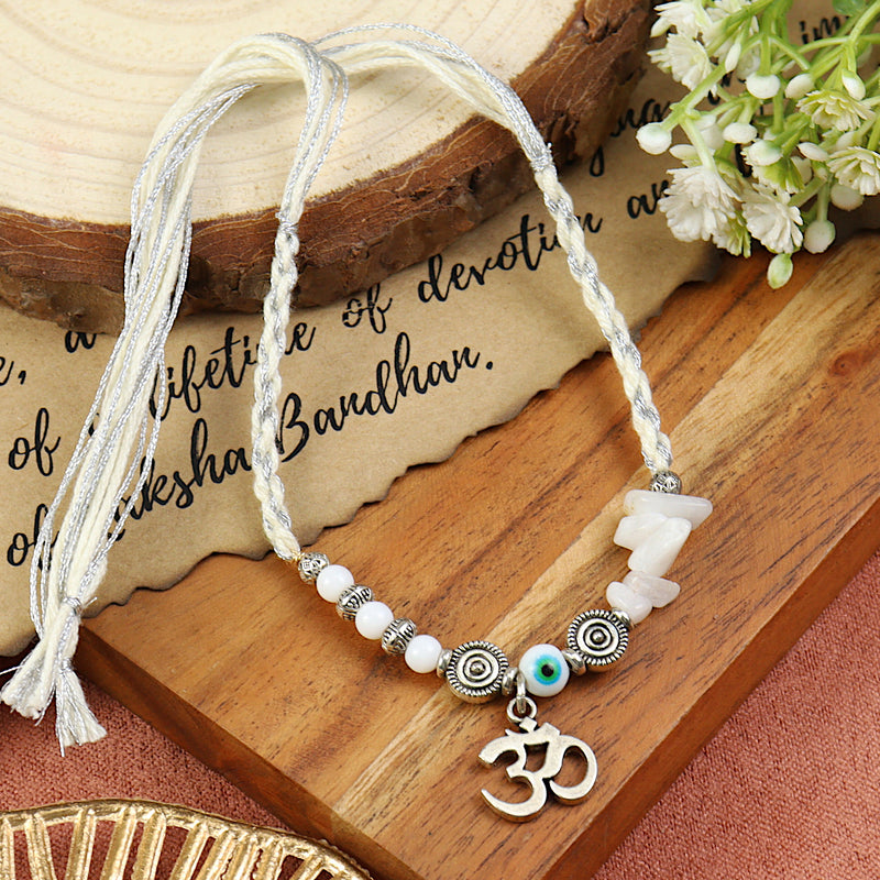 Moonstone Om Rakhi in moonstone, laid flat