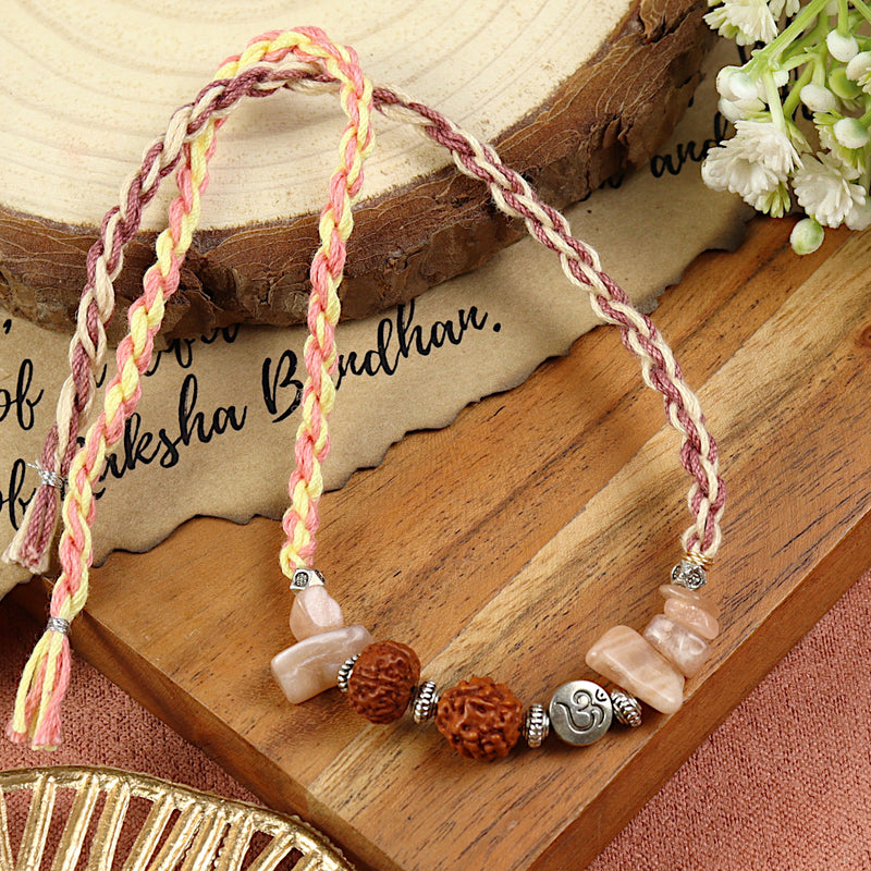 Sunstone Om Rudraksh Rakhi in sunstone, laid flat