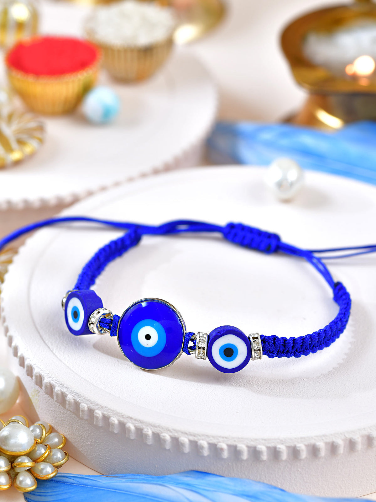 Evil Eye wrist bracelet Rakhi with Evil Eye charm on an adjustable cord