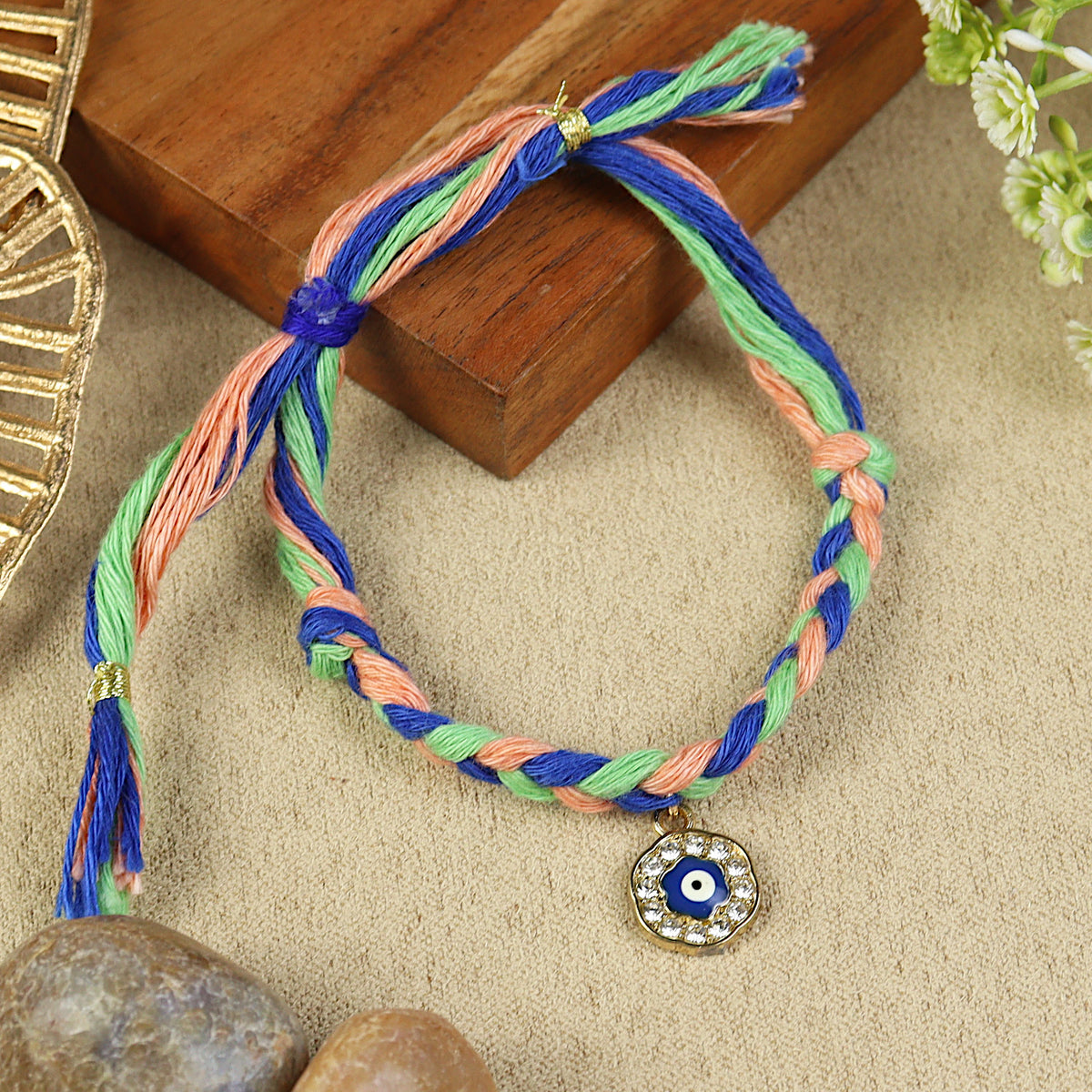 Hanging Evil Eye Tie-Up Bracelet Rakhi, laid flat