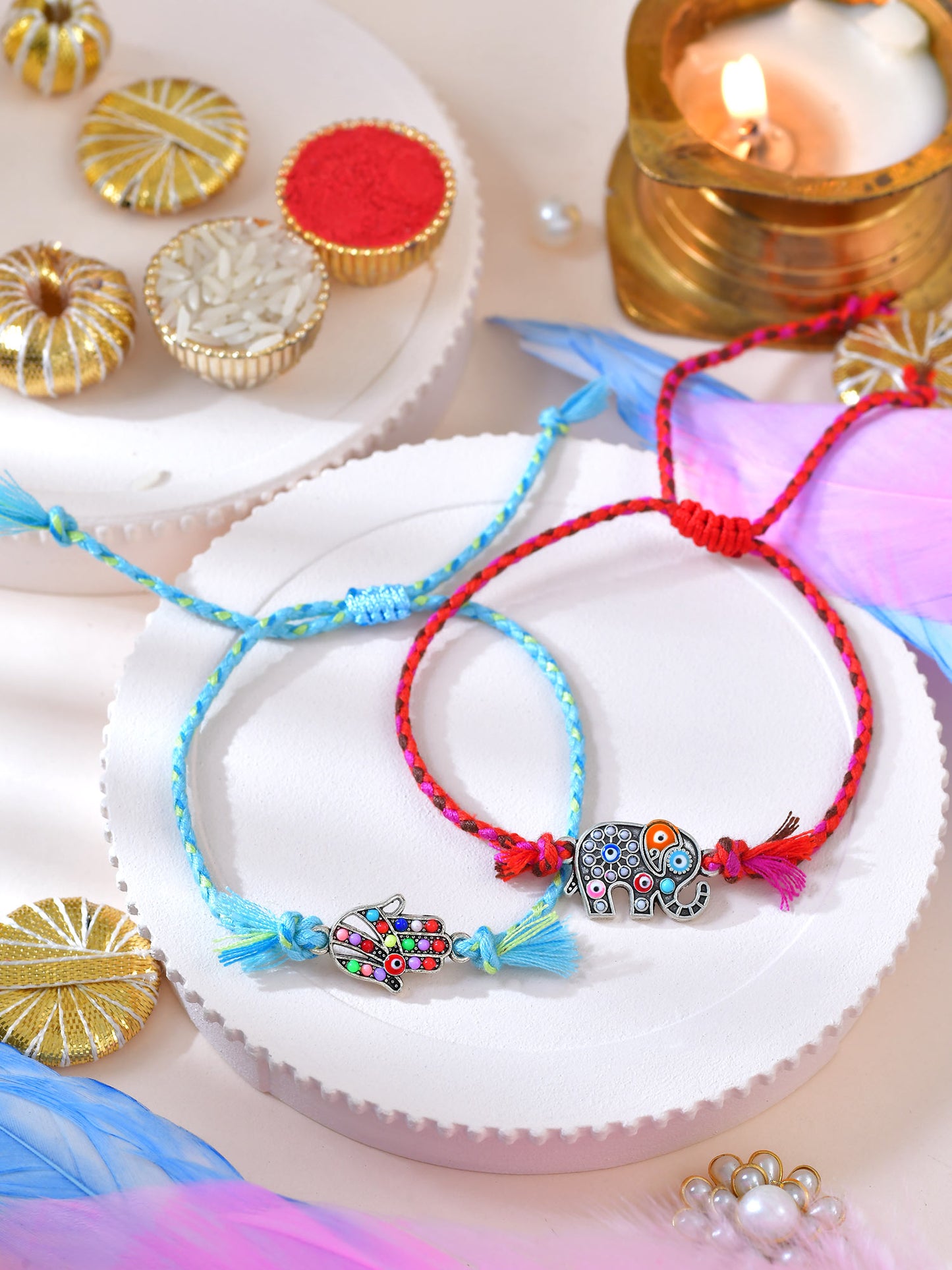 Elephant Hamsa Evil Eye Bracelet Rakhis set of 2 on a surface