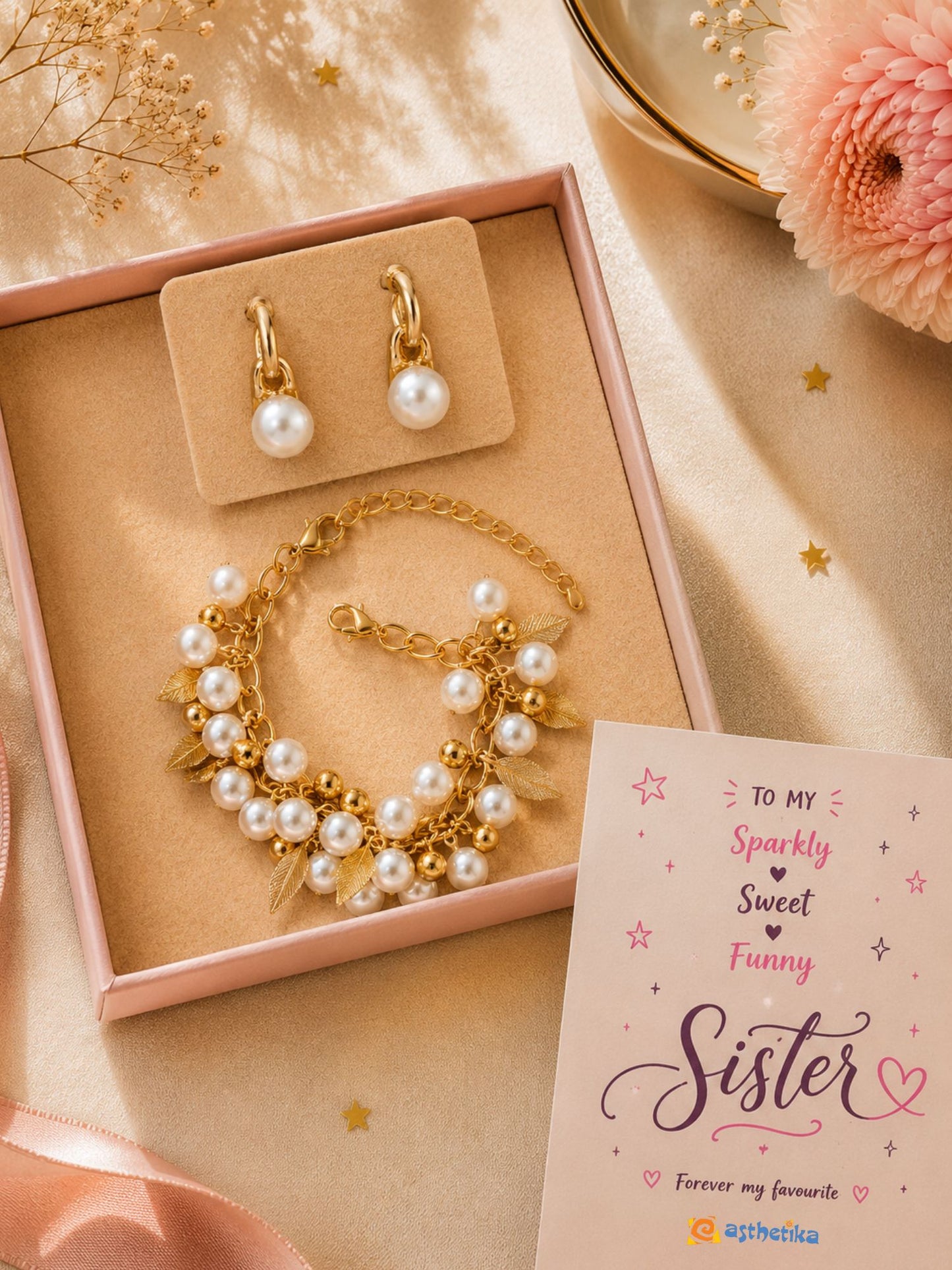 Pearls and golden leaf bracelet and earrings set, laid flat