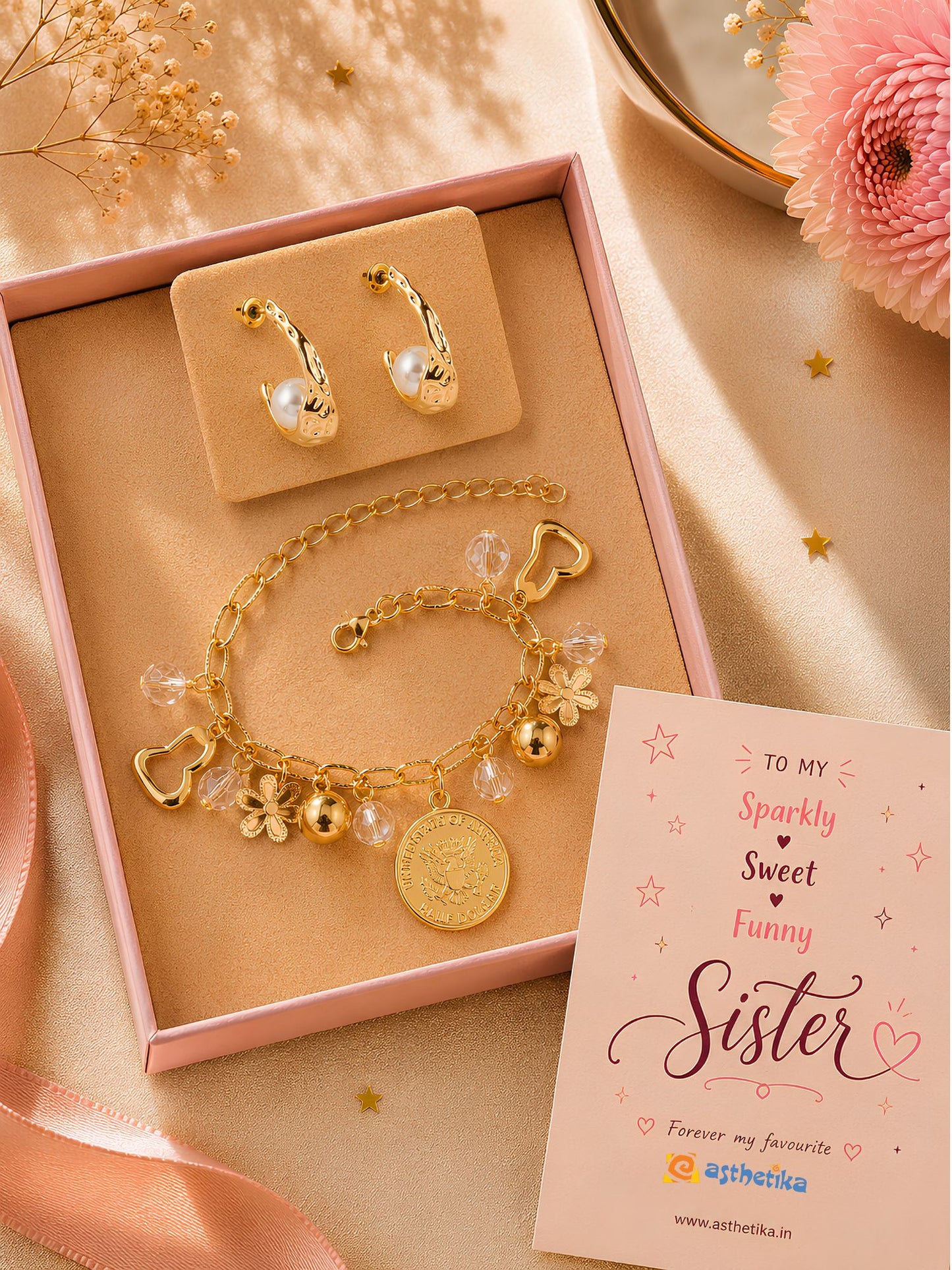 Pearls and hanging charms bracelet and earrings set, laid flat