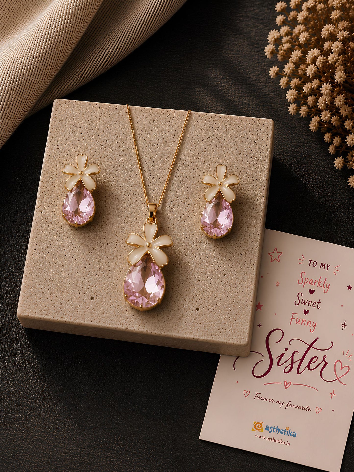 Teardrop crystal floral necklace and earrings set, laid flat