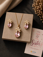 Teardrop crystal floral necklace and earrings set, laid flat